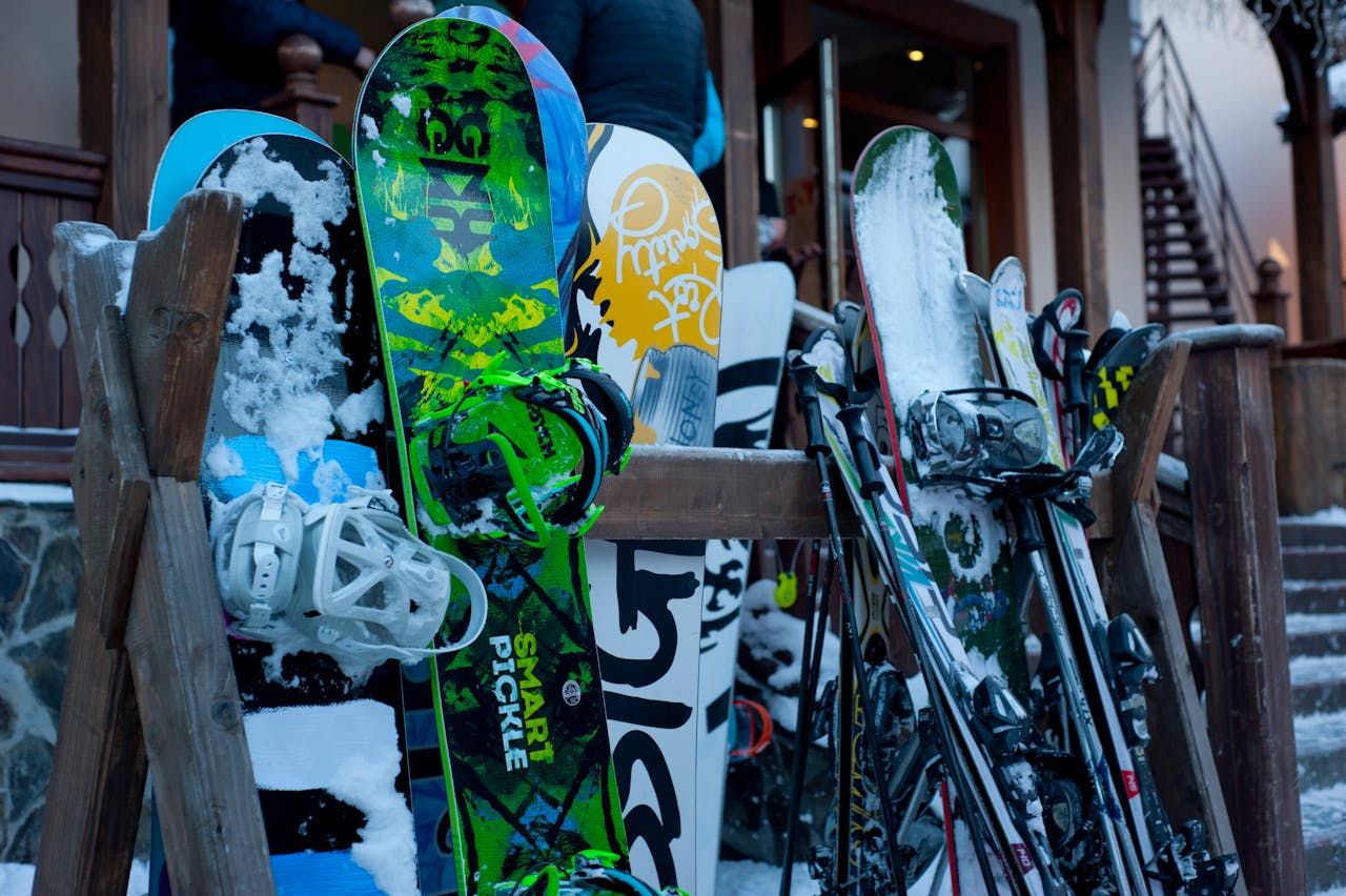The Art of Drawing Readers In: Your attractive post title goes here Snowboards and skis lined up outdoors at a winter ski lodge, showcasing vibrant designs.